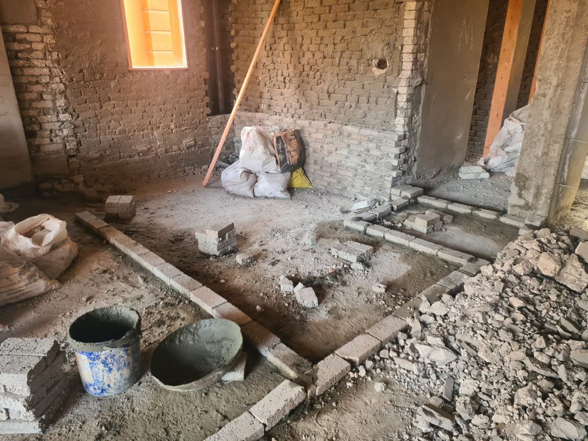 Before: L-Villa bathroom stripped back to rubble and blockwork