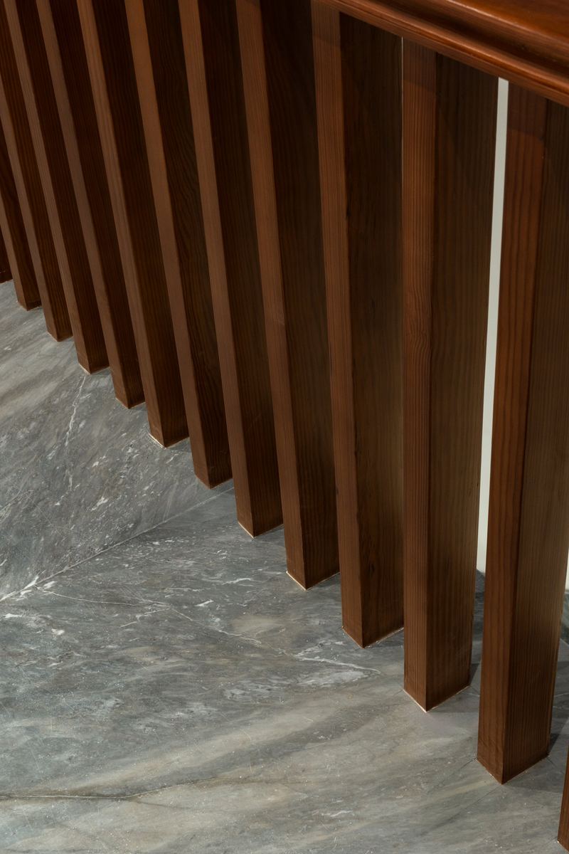 Close-up of the M-Villa timber slats over marble stair treads
