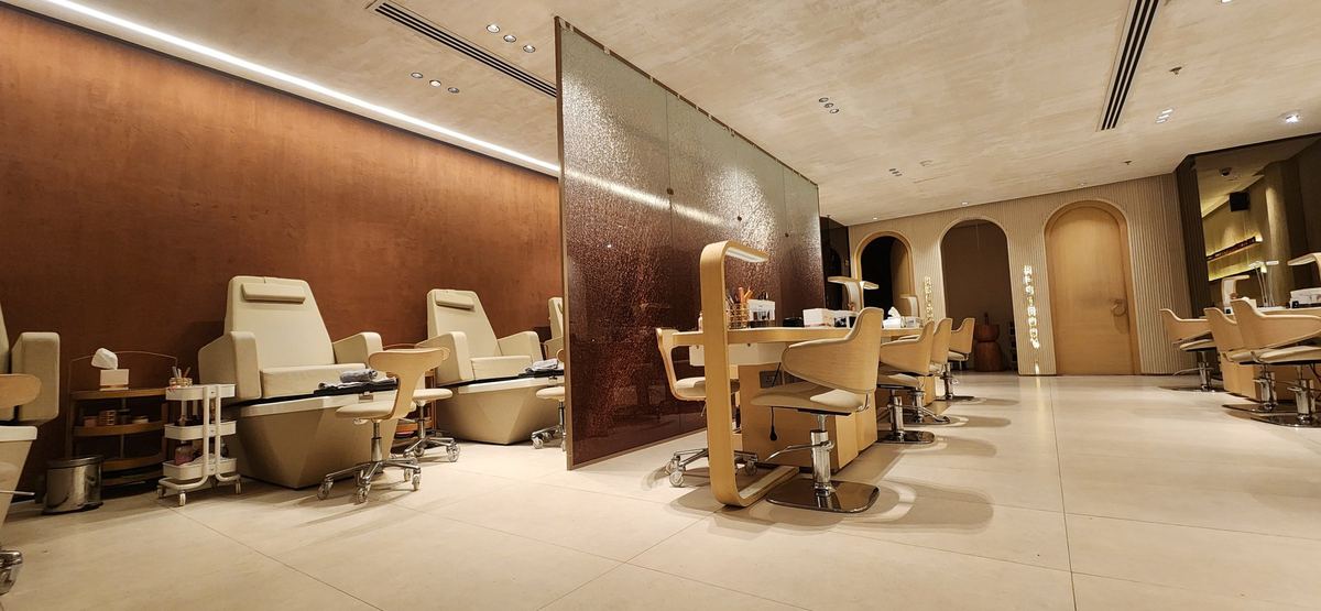 As delivered: pedicure chairs, the textured glass partition and the nail bar