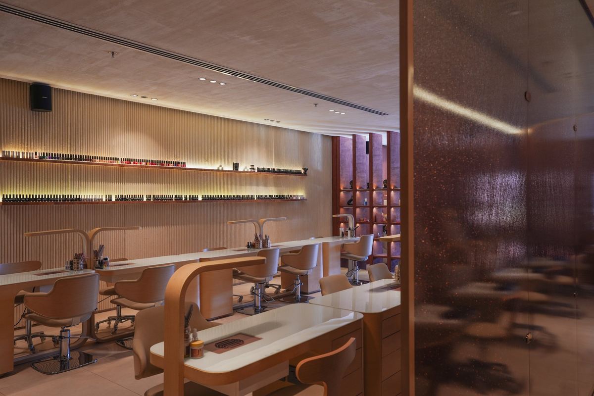 Polysh pedicure chairs and manicure stations with lit display shelves