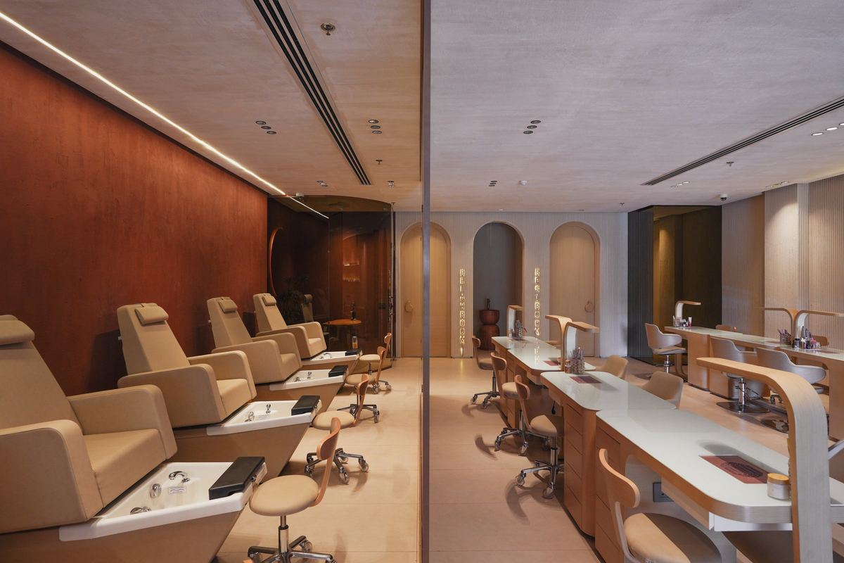 After: Polysh spa floor: manicure stations and pedicure chairs under arched niches