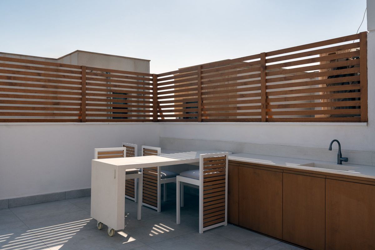 Sodic rooftop outdoor kitchen with the rotating table swung out