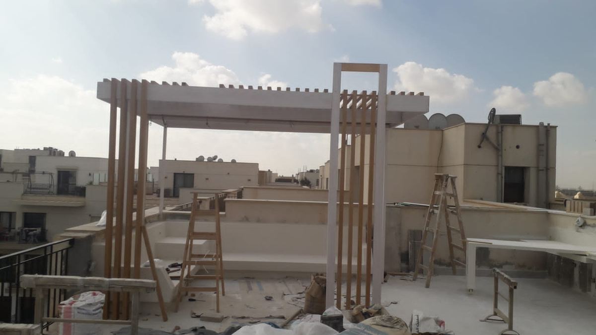 During: Sodic rooftop during works: pergola frame with battens going up